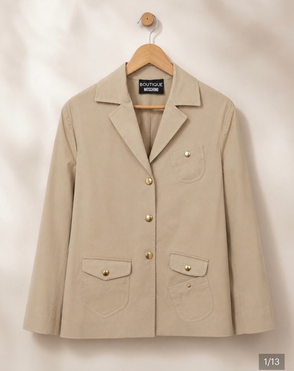 New with flaw: Boutique Moschino beige lightweight jacket in size 10